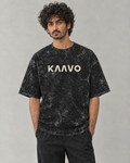 Kaavo acid-wash oversized tee in Black on model, front view